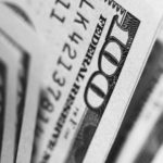 closeup photo of 100 US dollar banknotes
