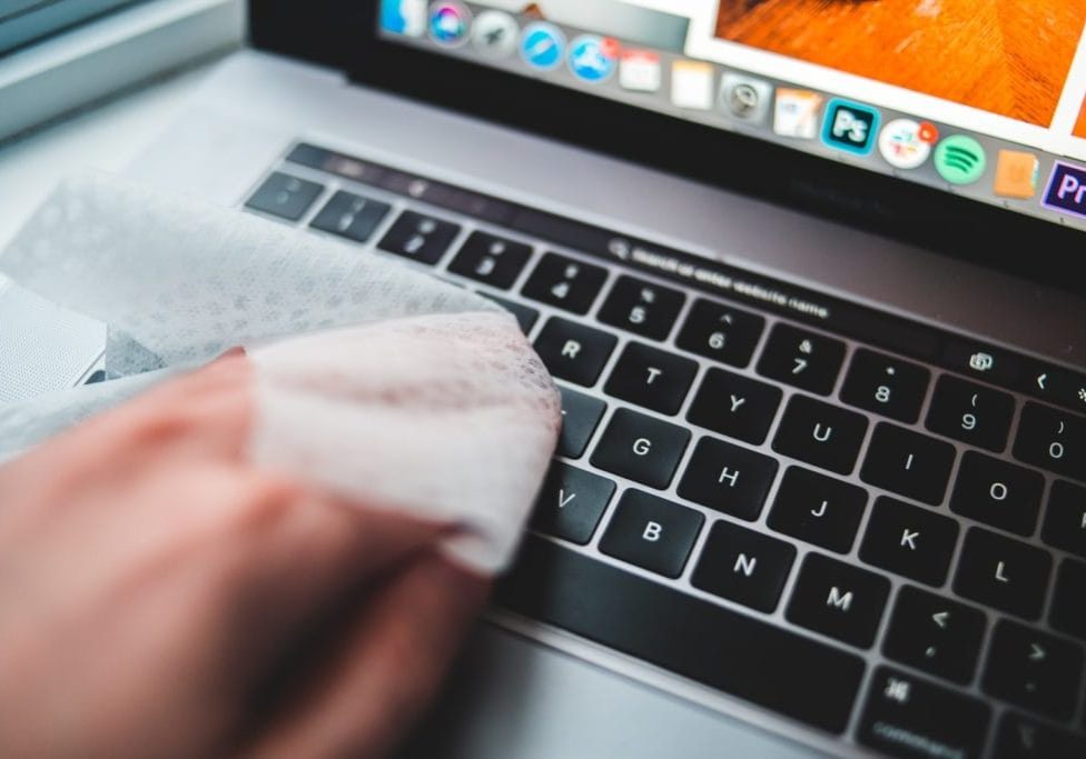 persons finger on macbook pro